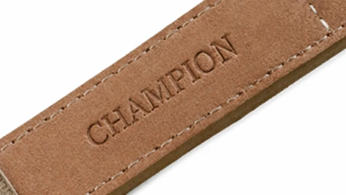 Stamped logo detail on textured leather, illustrating just one of our flexible branding solutions designed for OEM and private label clients.
