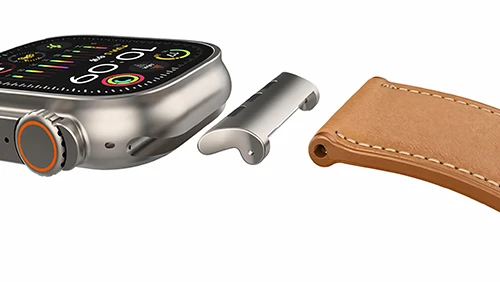 Apple Watch compatible strap assembly featuring a precision metal adapter and leather component, demonstrating our bespoke structural development for tech accessories.