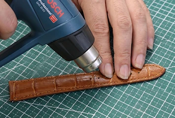 Thermal edge sealing on synthetic microfiber straps, illustrating the high-temperature fusion process that creates a durable, sealed edge for sport-grade accessories.